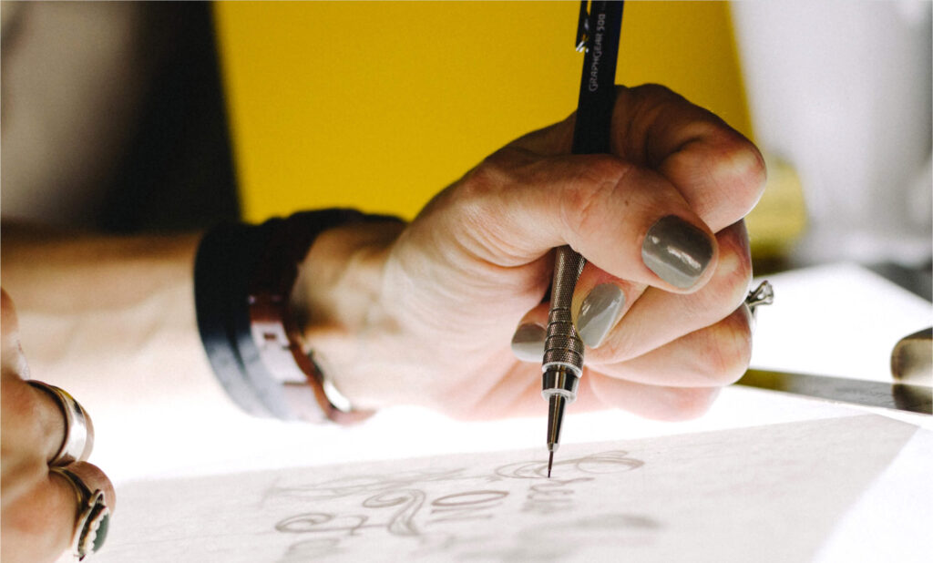 Woman working on a drawing board