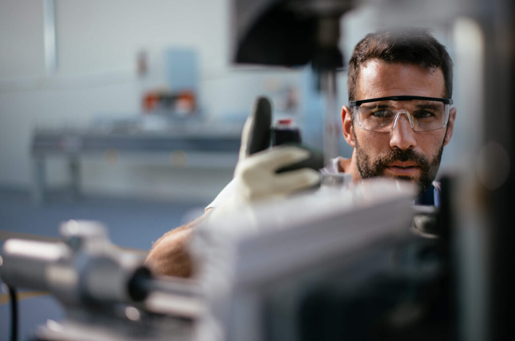 Man with safety glasses working