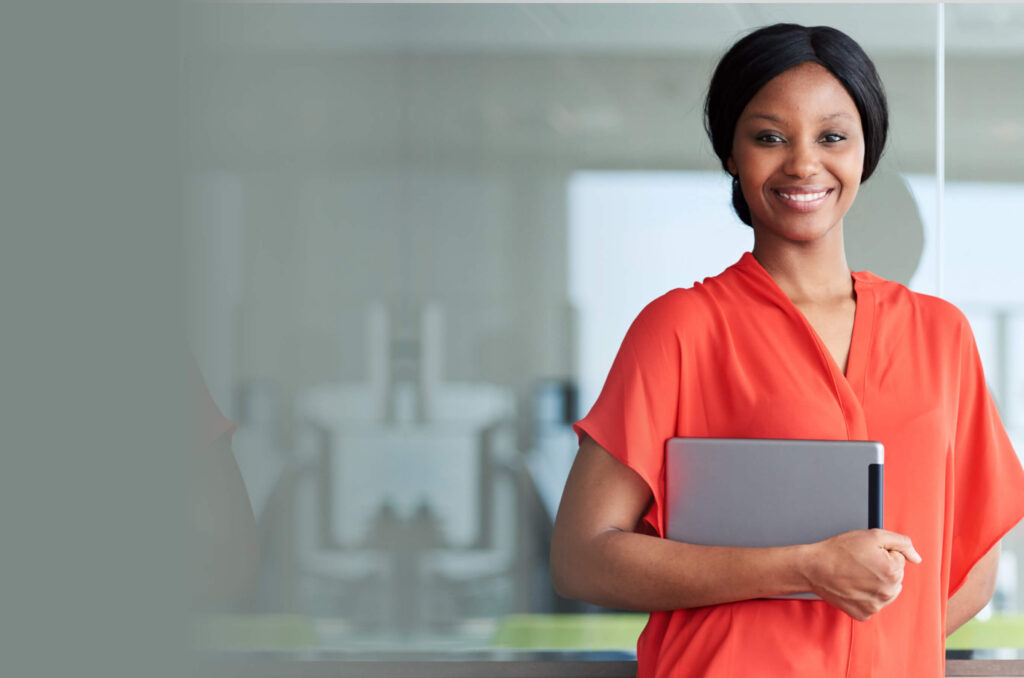Business woman smiling with iPad