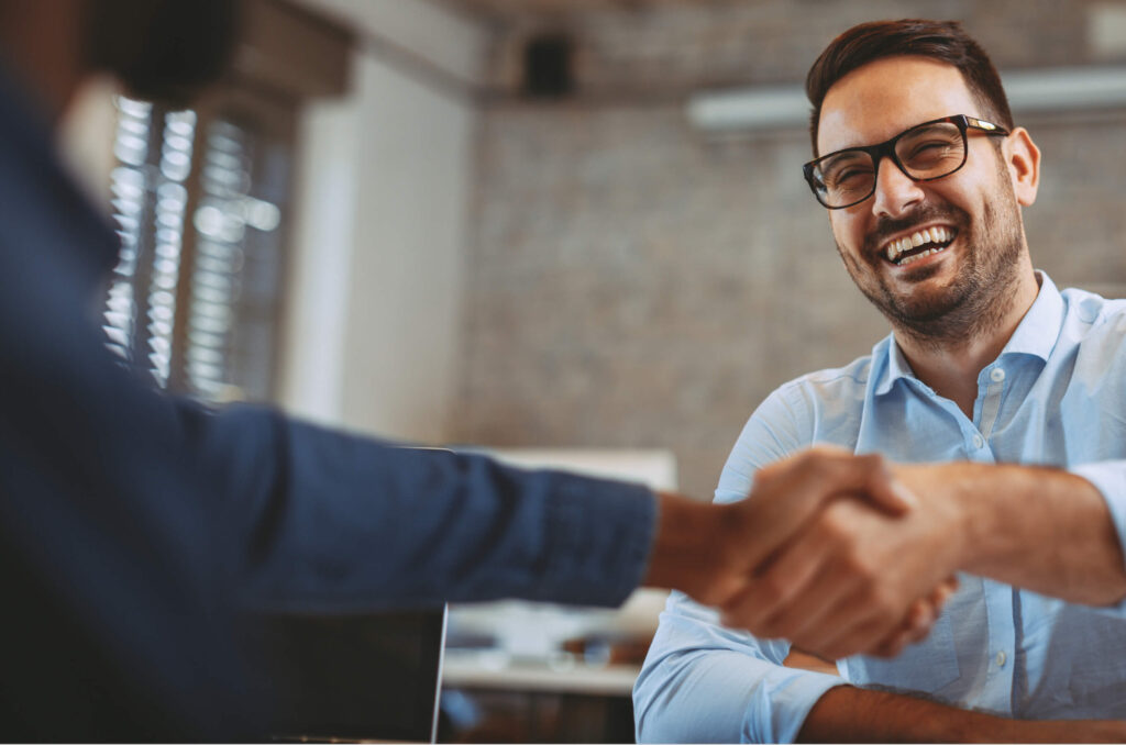 Man shaking someone's hand